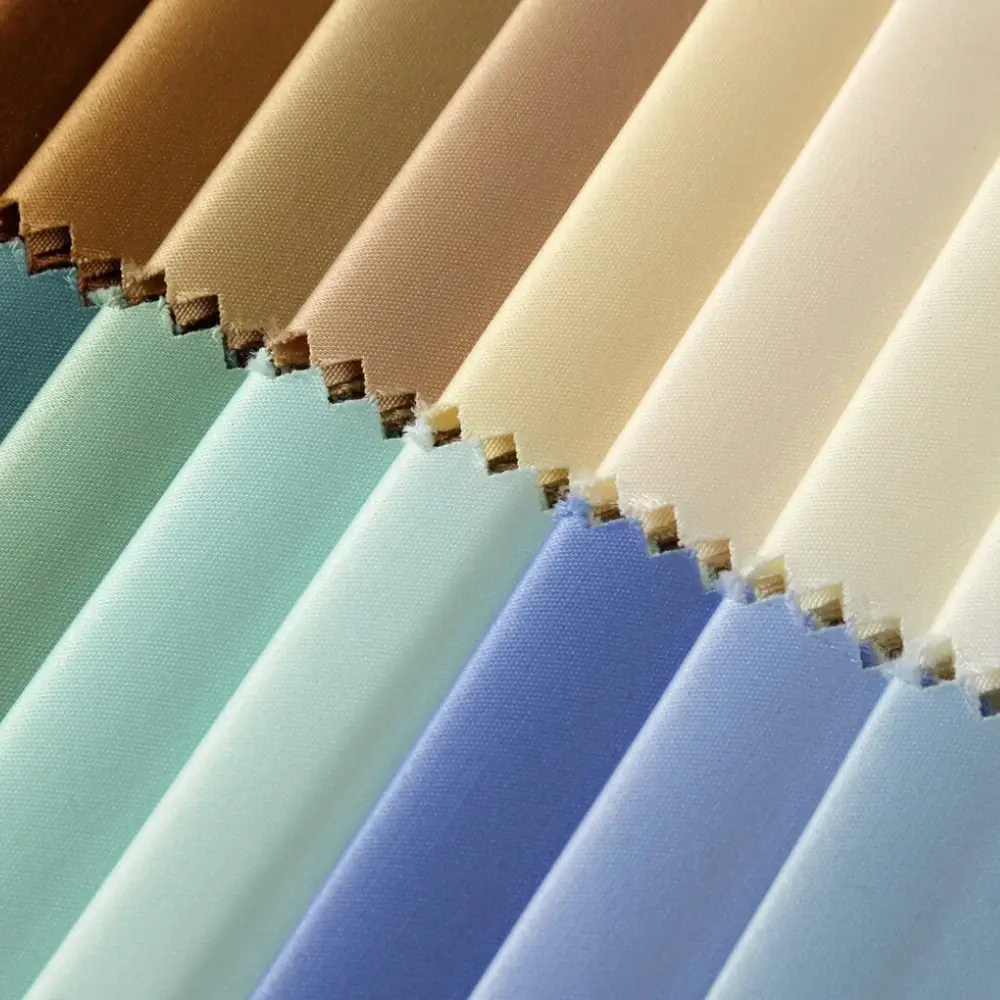 Fabric colour cards in cream, blue, green and brown