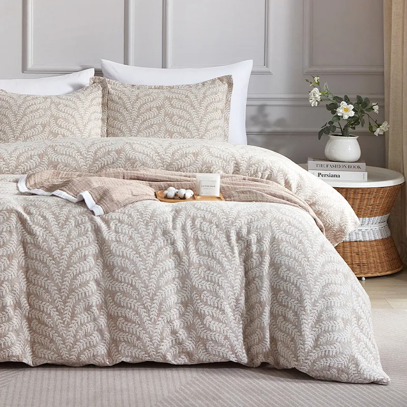Bed with cream leaf-pattern jacquard duvet cover and pillow cases