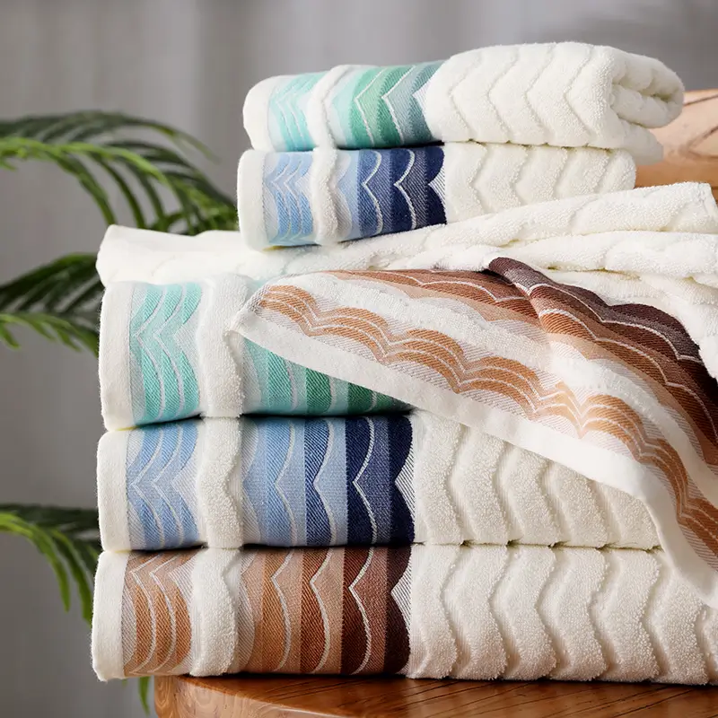 Stack of striped towels in white, blue, green and brown